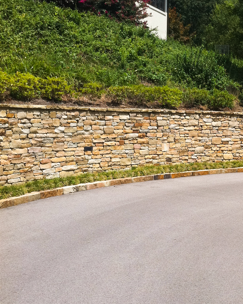 Earthtone Building Stone Wall with 2in Earthtone Wall Coping and Earthone Driveway Curbing