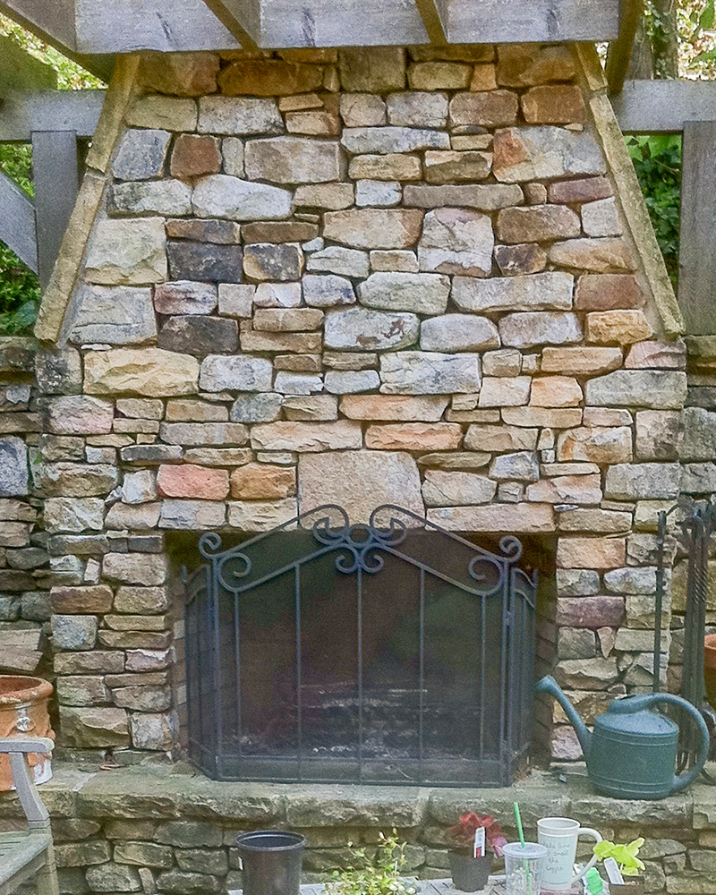 Medium Stack Moss Rock (Fieldstone) On Outdoor Fireplace