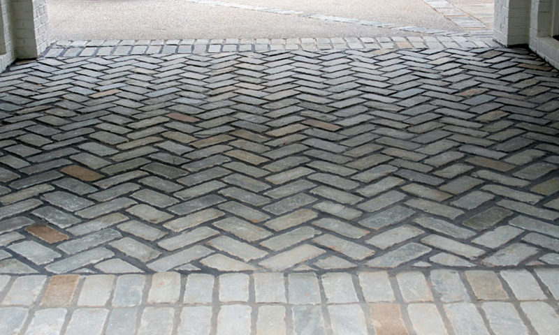 Blue Grey Sandstone Cobblestones Laid In A Herringbone Pattern